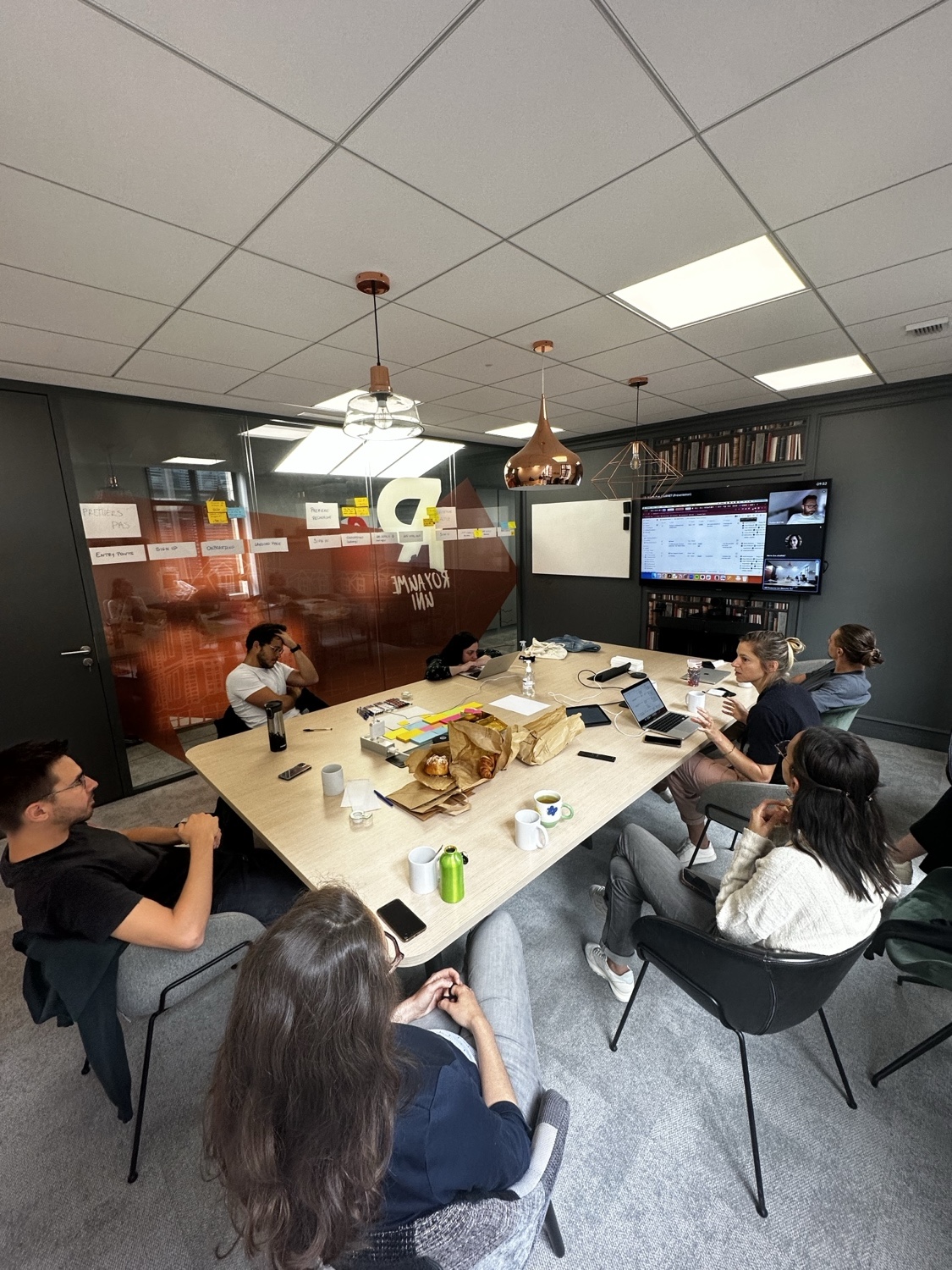 The team mapping the end-to-end student journey on a glass wall