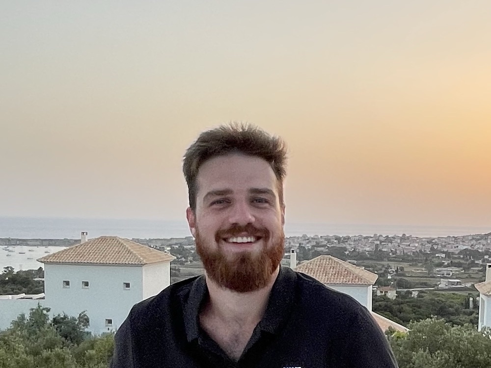 Me abroad during my design degree, at sunset over the coast